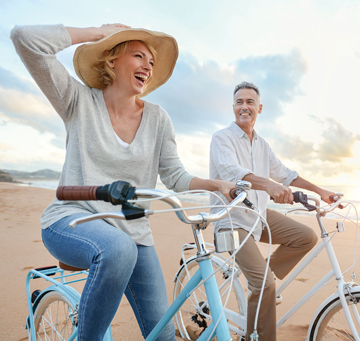 A couple riding bicycles. Links to Gifts of Life Insurance A couple riding bicycles. Links to Gifts of Life Insurance