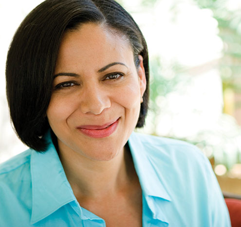 A woman smiling. Links to Beneficiary Designations